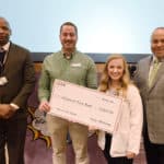 Emily McKinney, president of the Physician Assistant Studies Class of 2019, presents a check for $12,167.96 to Nick Bradford (second from left) from the Arkansas Food Bank during a Jan. 31 ceremony. The funds were raised during the PA students' Heroes Against Hunger 5K. They are joined by Edward Williams, MPAS, chair of the Department of Physician Assistant Studies and director of the PA program, and William Greenfield, M.D., from the Arkansas Medical, Dental & Pharmaceutical Association.