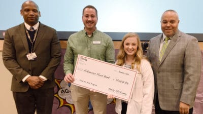 Emily McKinney, president of the Physician Assistant Studies Class of 2019, presents a check for $12,167.96 to Nick Bradford (second from left) from the Arkansas Food Bank during a Jan. 31 ceremony. The funds were raised during the PA students' Heroes Against Hunger 5K. They are joined by Edward Williams, MPAS, chair of the Department of Physician Assistant Studies and director of the PA program, and William Greenfield, M.D., from the Arkansas Medical, Dental & Pharmaceutical Association.