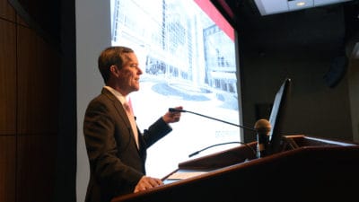 Chancellor Cam Patterson, M.D., MBA, addresses employees during his first State of the University presentation. Patterson said he is committed to ensuring every UAMS employee is paid a living wage.