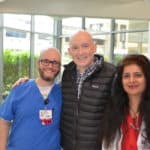 Third-year UAMS College of Medicine student and cancer survivor Corbin Norton (center) with his medical oncologist Rashmi Verma, M.D., (right) and nurse Jason Guenther, R.N.