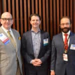 Rasco Symposium course director A. Mazin Safar, M.D., (left) pauses a moment with keynote speaker Ryan B. Corcoran, M.D., Ph.D., (center) and Issam Makhoul, M.D., director of the UAMS Divisions of Medical Oncology and Hematology, during the event.