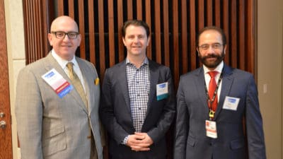 Rasco Symposium course director A. Mazin Safar, M.D., (left) pauses a moment with keynote speaker Ryan B. Corcoran, M.D., Ph.D., (center) and Issam Makhoul, M.D., director of the UAMS Divisions of Medical Oncology and Hematology, during the event.