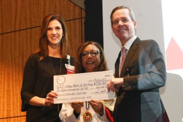 A record-tying $100,000 grant was awarded to support culinary medicine curriculum and an in-house food pantry. Tanya Johnson, at left, and Gloria Richard-Davis, M.D., accepted the grant.