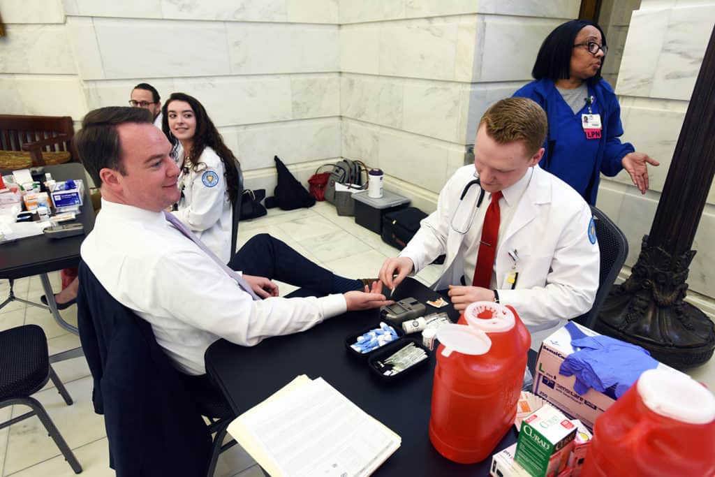 UAMS Students from the College of Pharmacy and College of Nursing provided biometric health screening during UAMS Day at the Capitol.