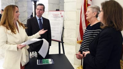Arkansas Sen. Missy Irvin of Mountain View (left) visits with UAMS Chancellor Cam Patterson, M.D., MBA; Cancer Institute Interim Director Laura Hutchins, M.D.; and Dorothy Graves, Ph.D., Cancer Institute associate director of administration, during UAMS Day at the Capitol.