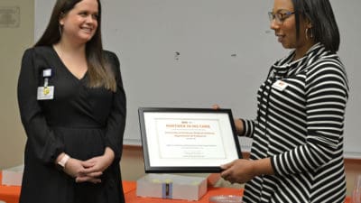 Dr. Willis receiving plaque
