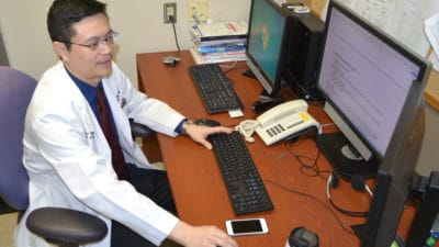 Dr. Mao at desk