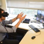 Using virtual reality technology, Nathan King experiences a simulation of vision and hearing loss.