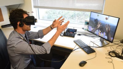 Using virtual reality technology, Nathan King experiences a simulation of vision and hearing loss.