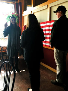 Anthony being sworn into military service by her mother, a veteran.