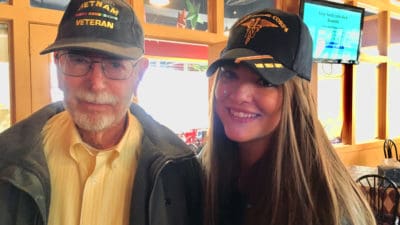 Codi Anthony, soon to graduate with a doctor of nursing practice and newly direct commissioned as a captain, with her father, who served in Vietnam.