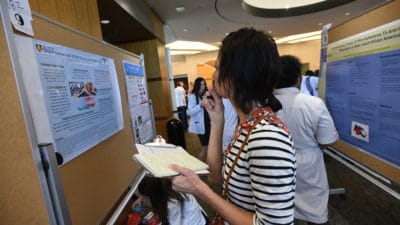 Attendees browse posters at the 2019 Annual Arkansas Nursing Research Conference.