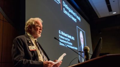 Dr. Smith at podium