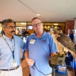 A Little Rock Zoo interpreter shows off a hawk at the UAMS celebration of Earth Day.