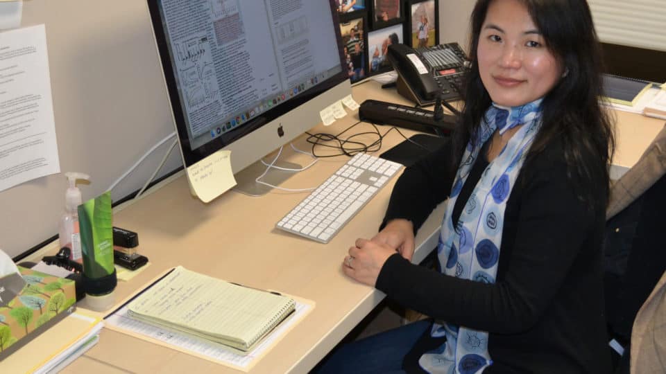 Dr. Liu at desk