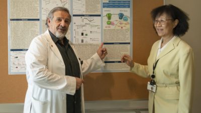 Center for Translational Neuroscience Director Edgar Garcia-Rill, Ph.D., with Vice Chancellor for Research Shuk-Mei Ho, Ph.D.