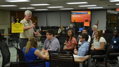 INBRE workshop organizer Tom Kelly, Ph.D., gives instructions about the day's activities.
