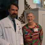 Matthew Steliga, M.D., (left) is joined by UAMS Cancer Institute Interim Director Laura Hutchins, M.D., following his introduction as the UAMS Cancer Institute Auxiliary Distinguished Honoree.