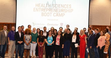 The entire class of the 2019 Health Science Entrepreneurship Boot Camp and some of the students' instructors and mentors take a moment for one last photo before the end of the weeklong class.