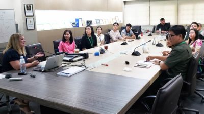 Schwanda Flowers, Pharm.D., far left, visits with faculty at Silpakorn University in Thailand.