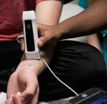 Students use ultrasound on a wrist