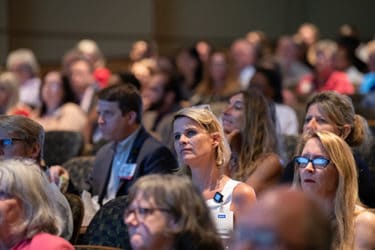 Faculty, staff and students at the town hall meeting listen as the Vision 2029 plan is presented.