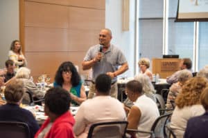 Steve Biernacki, Restore director for Habitat for Humanity of Central Arkansas, congratulates the UAMS Medical Center volunteers on their service to others and encourages them to continue to give back.