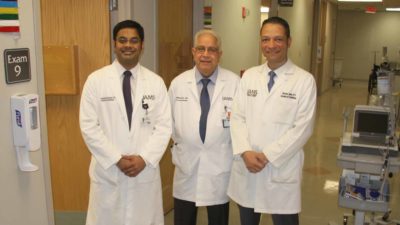Portrait of Pothineni, Mehta, and Saad in a clinical hallway
