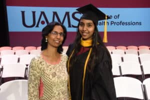 Sharvari Bharambe (right) said she was glad her mother was able to fly to Little Rock from India to be present for all the commencement activities. Bharambe earned a Master of Science in Communication Sciences and Disorders.