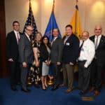 Curtis Lowery, M.D., second from left, stops for a photo with Secretary of Health and Human Services Alex M. Azar, fifth from left, during a break in the secretary's Roundtable with Rural Health Innovators. Lowery gave a presentation at the roundtable along with representatives from programs in other states who are showen here with Lowery and Azar.