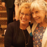 Judy Huneycutt and Jill Lancaster, both CON '69, pose for photos during the Saturday night Golden Grad dinner at the Capital Hotel.