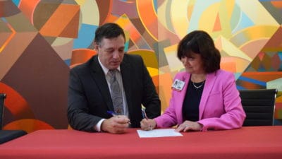 Dr. Randy Esters, North Arkansas College president, and Stephanie Gardner, Pharm.D., Ed.D., UAMS provost, sign an agreement Monday in to allow Northark Medical Laboratory Technology (MLT) graduates to transfer to an online program at UAMS to earn a Bachelor of Science degree in Medical Laboratory Sciences (MLS).