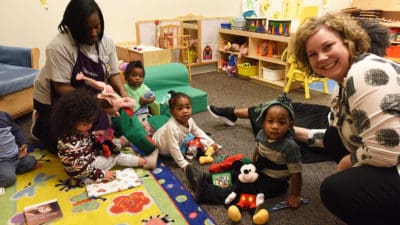 Head Start students enjoying a surprise donation of books, games and toys in 2018.