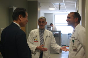 Sami Uwaydat leads Choi on a tour of his clinic at the Jones Eye Institute and introduces him to other physicians.