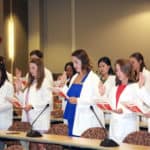 First-year students in the Department of Audiology and Speech Pathology in the College of Health Professions recite the Therapist's Oath during a white coat ceremony Aug. 16.