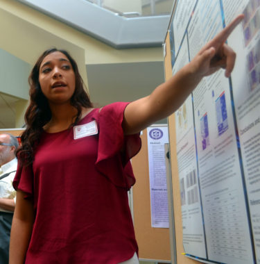 Female student presenting poster