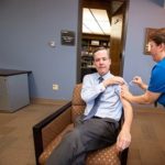 UAMS Chancellor Cam Patterson receives his flu shot in preparation for the 2019-2020 flu season.