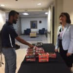 Medical student Dhruba Dasgupta receives a Kind bar from Stephanie Gardner, Senior Vice Chancellor for Academic Affairs & Provost, during Kindness Week.