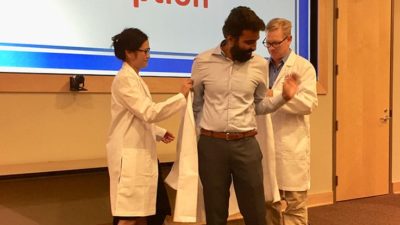 Twenty-five UAMS Graduate School students from seven programs received white lab coats Sept. 16, signaling their readiness to begin doctoral research.