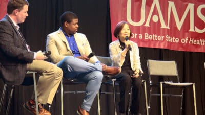 Jeanne Wei, M.D., Ph.D., right, and Johnathan Goree, M.D., center, take part in a panel discussion on “New Treatments for Managing Pain.”