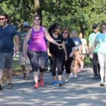 Participants at the Walk with a Doc event Sept. 7 stroll around the track at War Memorial Stadium.