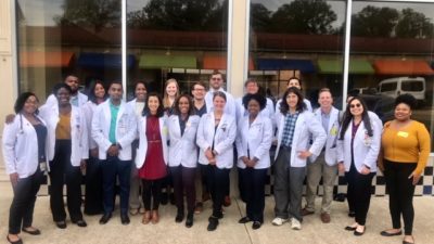 UAMS student volunteers gather for a group photo during a visit to KIPP Delta Collegiate High School in Helena-West Helena.