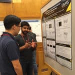 Maroof Zafar, center, discusses his research during a poster presentation at Cold Spring Harbor Laboratory.