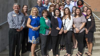 Twenty-eight members of the College of Health Professions faculty graduated from UAMS. (L-R, first row) Tony Baker, Catherine Smith, Con-nie Bracy, Layla Simmons, Lisa Rhoden, Cherika Robertson, Claire Tucker (second row) Lindsay Gilbert, Kathy Atkinson, Katy Warren, Lindsey Clark, Alicia Baird (third row) Ellis McVoy, Tiffany Lepard Tassin, John Calloway, Tonya Cook (fourth row) Jason Key, Leslie Spurlock, Art Maune (top row) Bryson Howard, Lesley Jones, Betholyn Gentry, Tom Jones. Not shown: Shannon Turley, Christi Arthur, DeAndria Green, Allison Wingfield and Ashley McCrary.