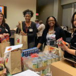 About 150 members of Team UAMS volunteered to build Thanksgiving bags for Stocked & Reddie, the UAMS food pantry.