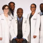 Antino Allen, seated center, leads one section of the College of Pharmacy's graduate program. Some of his students, left to right, are Madison Trujillo, Taylor McElroy, Tauren Brown, Pilar Simmons and Fabio Ntagwabira. Lab technician and research associate Jing Wang, M.D., Ph.D., is a research associate on Allen's research team.