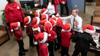 A group of preschoolers from the UAMS Head Start program recently celebrated the winter holidays by sharing songs with Chancellor Cam Patterson, M.D., MBA and others at UAMS.