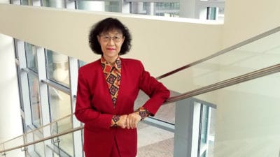 Portrait of Dr. Ho on staircase