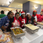 Members of the Nutrition Services team smile as they get ready to serve thousands of their fellow employees. “Throwing a party of this size is a massive undertaking, and there is no way we could have pulled it off without Tonya Johnson and her team from Nutrition Services," said Annabeth Collier.