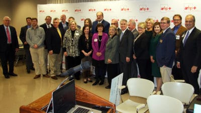 CEOs of Arkansas hospitals that are part of the Arkansas Rural Health Partnership, UAMS and Blue Cross and Blue Shield officials gather for a group photo after a news conference in Pine Bluff.